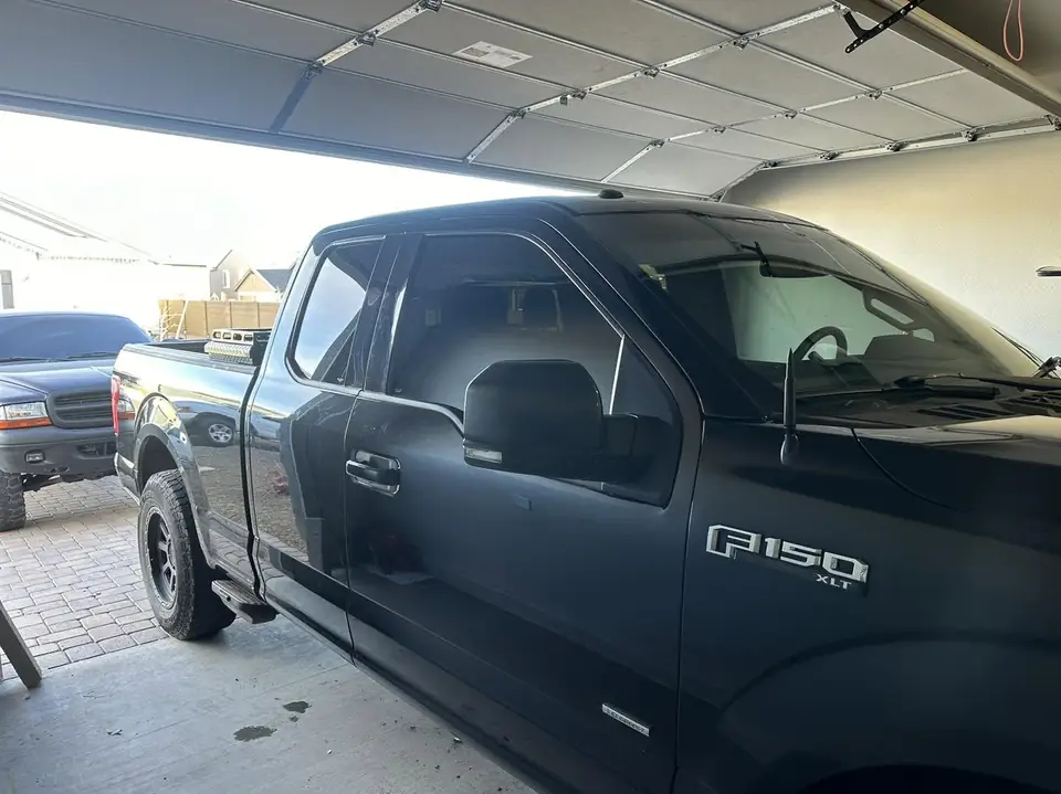 2015 Ford F-150 window tint: Strip all the old tint, 5% Ceramic rear 3 windows, 15% Ceramic front 2 windows (view 2)