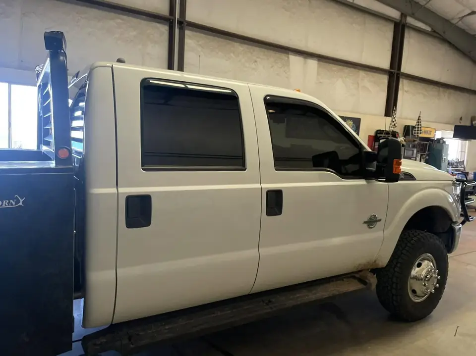 2015 Ford F-350 window tint: Premium 5% rear 3 windows, Premium 15% front windows, 5% windshield strip (view 3)