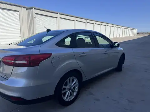 2015 Ford Focus window tint: 15% Rear 3 windows, 25% front doors, 5% sun strip (view 2)