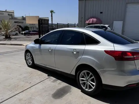 2015 Ford Focus window tint: 15% Rear 3 windows, 25% front doors, 5% sun strip (view 3)