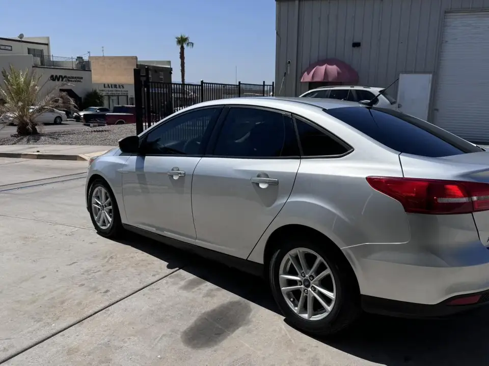 2015 Ford Focus window tint: 15% Rear 3 windows, 25% front doors, 5% sun strip (view 3)