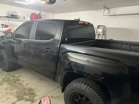 2015 GMC Canyon window tint: 2015 GMC Canyon getting Blackout package, 5% Premium Ceramic all doors and rear glass, 5% windshield strip, Dark smoke (view 2)