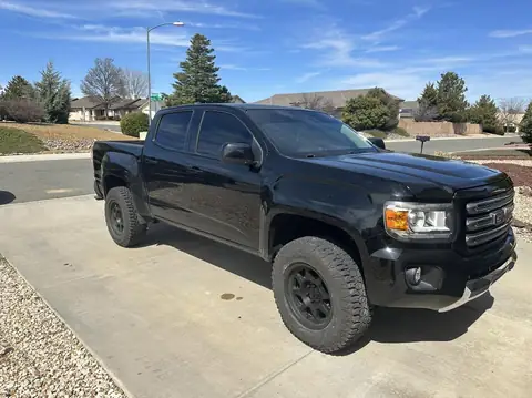 2015 GMC Canyon window tint: 2015 GMC Canyon getting Blackout package, 5% Premium Ceramic all doors and rear glass, 5% windshield strip, Dark smoke (view 3)