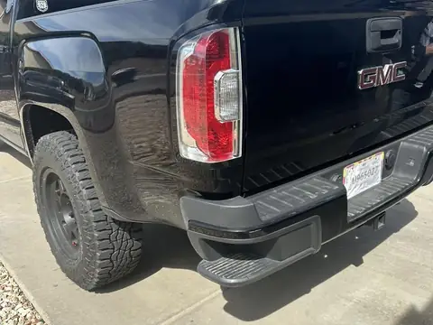 2015 GMC Canyon window tint: 2015 GMC Canyon getting Blackout package, 5% Premium Ceramic all doors and rear glass, 5% windshield strip, Dark smoke (view 4)
