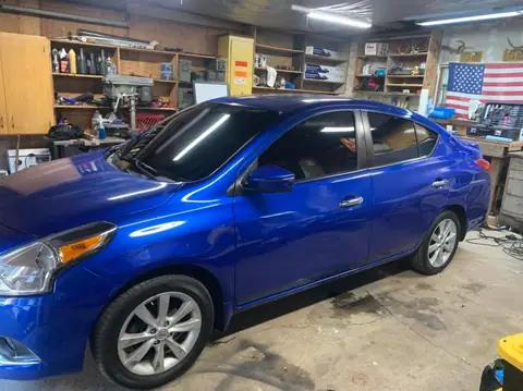 2015 Nissan Versa window tint: 15% ceramic on all windows and front windshield (view 2)
