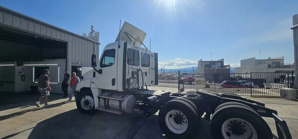 2016 Freightliner Cascadia window tint: 5% all sides & rear glass with a 3% Windshield Visor Strip (view 5)