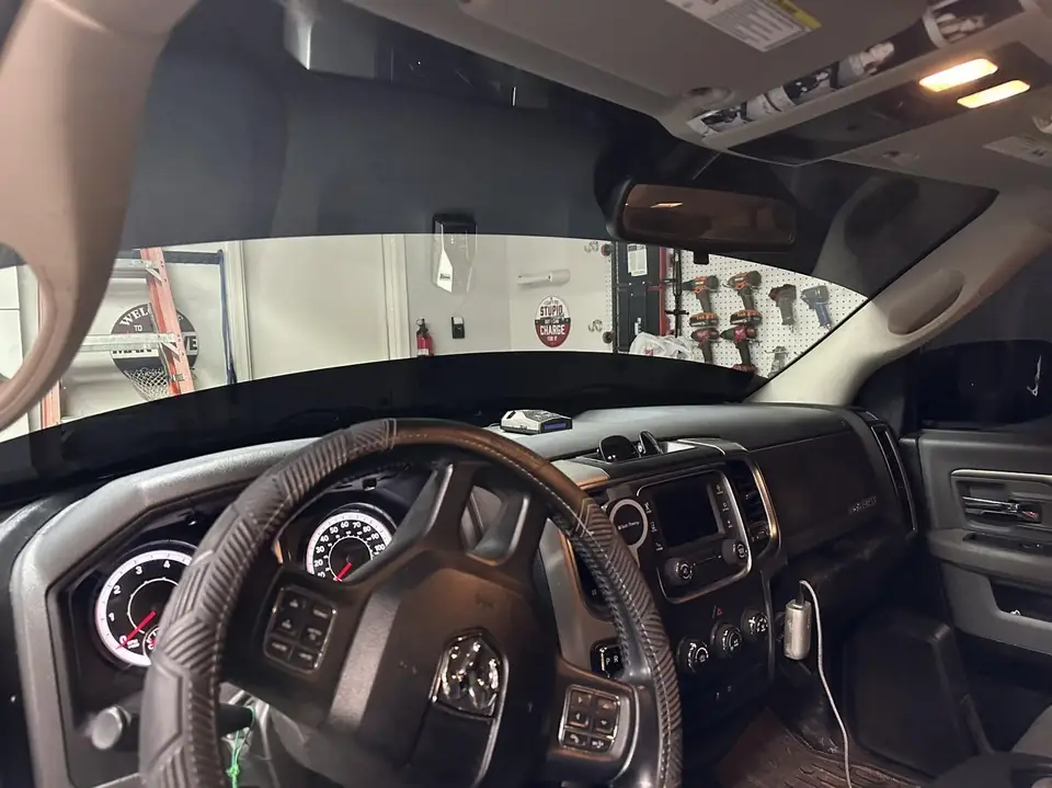2016 Ram 1500 window tint: Double layer of 3% over rear privacy glass, 3% front doors, 3% top and bottom windshield strips (view 3)