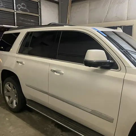 2018 Cadillac Escalade window tint: Premium 5% over front 35% and rear factory privacy glass