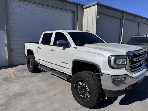 2018 GMC Sierra window tint: Removal on front doors, 5% C-IR all the way around, 35% C-IR full windshield