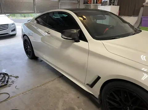 2018 Infiniti Q60 window tint: Removed old faded tint from front windows, Installed 5% premium ceramic on all windows