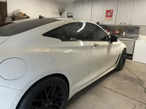 2018 Infiniti Q60 window tint: Removed old faded tint from front windows, Installed 5% premium ceramic on all windows (view 2)