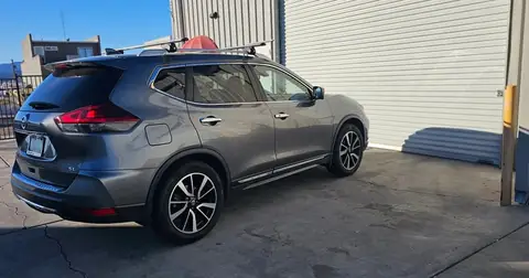 2018 Nissan Rogue window tint: 40% over rear half privacy windows (8% read), 20% front door windows, 3% windshield strip (view 2)