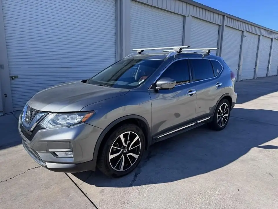 2018 Nissan Rogue window tint: 40% over rear half privacy windows (8% read), 20% front door windows, 3% windshield strip (view 4)