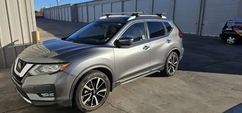 2018 Nissan Rogue window tint: 40% over rear half privacy windows (8% read), 20% front door windows, 3% windshield strip (view 5)