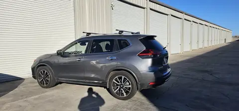 2018 Nissan Rogue window tint: 40% over rear half privacy windows (8% read), 20% front door windows, 3% windshield strip (view 6)