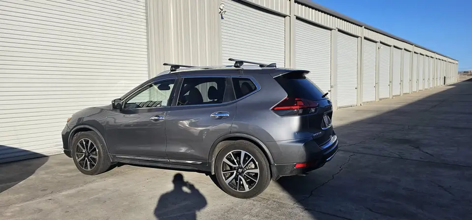 2018 Nissan Rogue window tint: 40% over rear half privacy windows (8% read), 20% front door windows, 3% windshield strip (view 6)