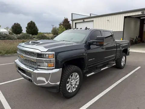 2019 Chevrolet Silverado window tint: Old film removed from the front doors, then 5% on the doors and rear glass with a windshield strip, done at the shop in Prescott Valley