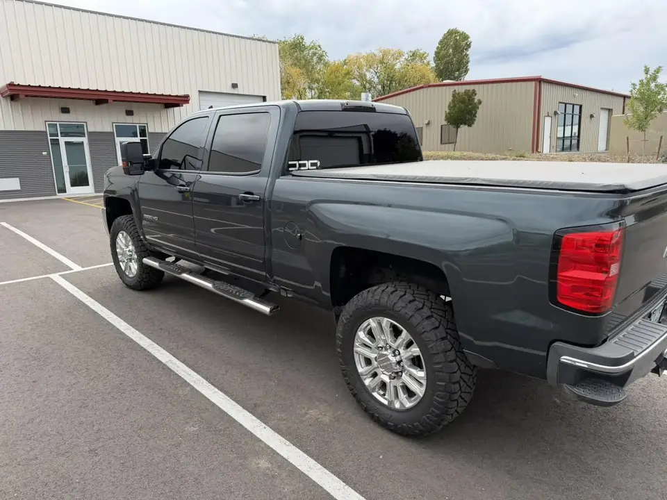 2019 Chevrolet Silverado window tint: Old film removed from the front doors, then 5% on the doors and rear glass with a windshield strip, done at the shop in Prescott Valley (view 2)