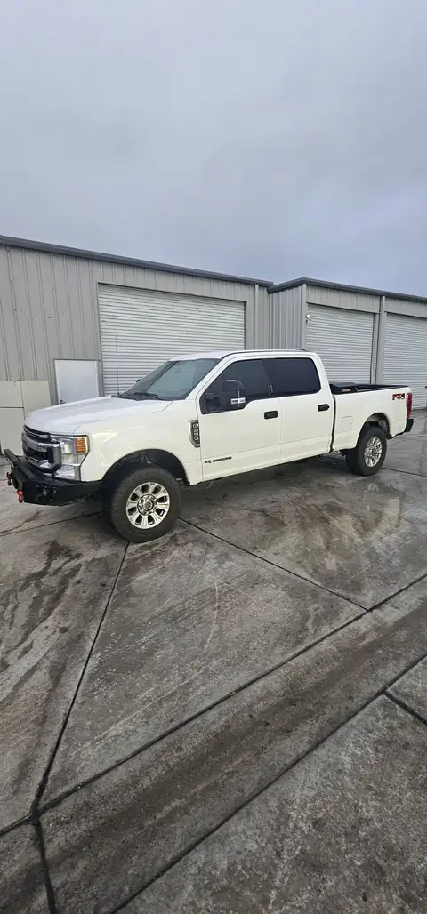 2020 Ford F-250 window tint: Remove old tint from front door windows, Installed 20% on front 2 door windows, Installed 40% on Windshield