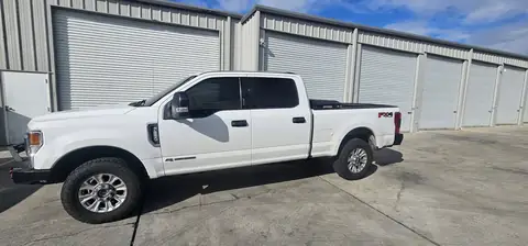 2020 Ford F-250 window tint: Remove old tint from front door windows, Installed 20% on front 2 door windows, Installed 40% on Windshield (view 2)