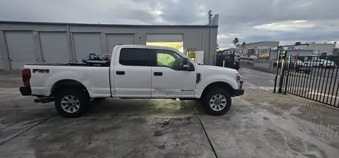 2020 Ford F-250 window tint: Remove old tint from front door windows, Installed 20% on front 2 door windows, Installed 40% on Windshield (view 3)
