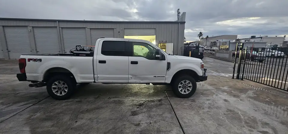 2020 Ford F-250 window tint: Remove old tint from front door windows, Installed 20% on front 2 door windows, Installed 40% on Windshield (view 3)