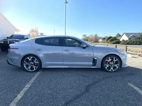 2021 Kia Stinger window tint: Removed all old faded tint, 15% Ceramic front doors, 5% Ceramic rear doors, 5% sunstrip @8inch
