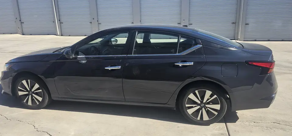2021 Nissan Altima window tint: 20% Sides & Rear with a 3% Windshield Visor Strip (view 3)