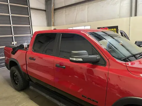 2021 Ram 1500 Rebel window tint: Removed peeling tint from previous installer, Installed premium 5% on front doors