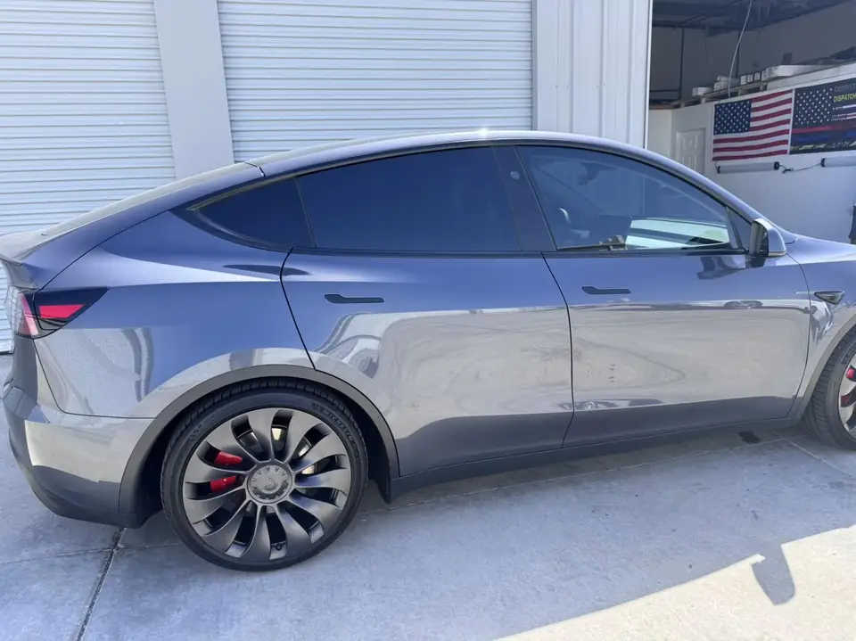 2023 Tesla Model Y window tint: Remove 15% from 2 fronts and installed new 5%, Remove 5% from sunroof and installed new 35% over factory privacy glass (view 2)
