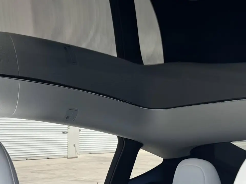 2023 Tesla Model Y window tint: Remove 15% from 2 fronts and installed new 5%, Remove 5% from sunroof and installed new 35% over factory privacy glass (view 3)