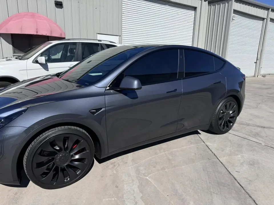 2023 Tesla Model Y window tint: Remove 15% from 2 fronts and installed new 5%, Remove 5% from sunroof and installed new 35% over factory privacy glass (view 5)