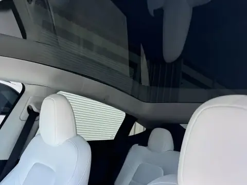 2023 Tesla Model Y window tint: Remove 15% from 2 fronts and installed new 5%, Remove 5% from sunroof and installed new 35% over factory privacy glass (view 6)