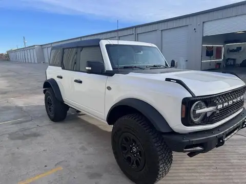 2024 Ford Bronco window tint: Removed film on both front door windows & replaced with 20%, Installed 35% on full windshield
