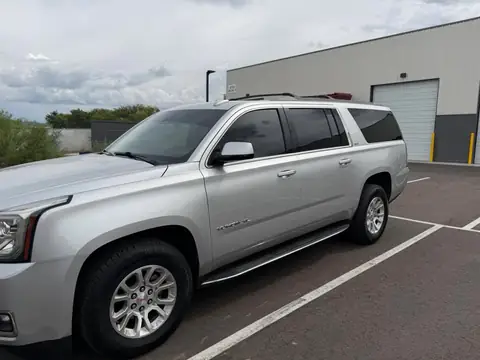 2024 GMC Yukon XL window tint: Front doors in 20% to match the rear privacy glass, 5% windshield strip, done at the shop in Prescott Valley