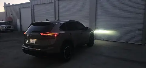 2024 Nissan Rogue window tint: 20% Carbon On Front 2 Windows, 5% Carbon on all Rears, 5% Carbon Visor Strip (view 4)