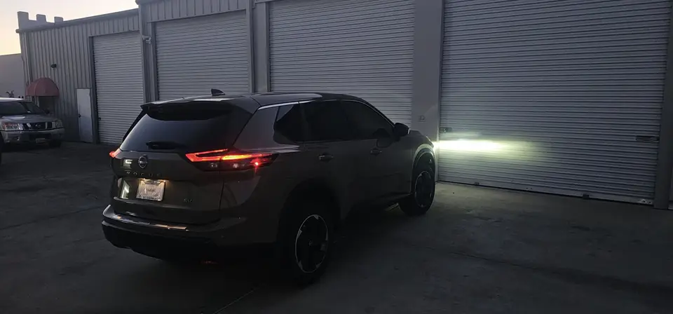 2024 Nissan Rogue window tint: 20% Carbon On Front 2 Windows, 5% Carbon on all Rears, 5% Carbon Visor Strip (view 4)