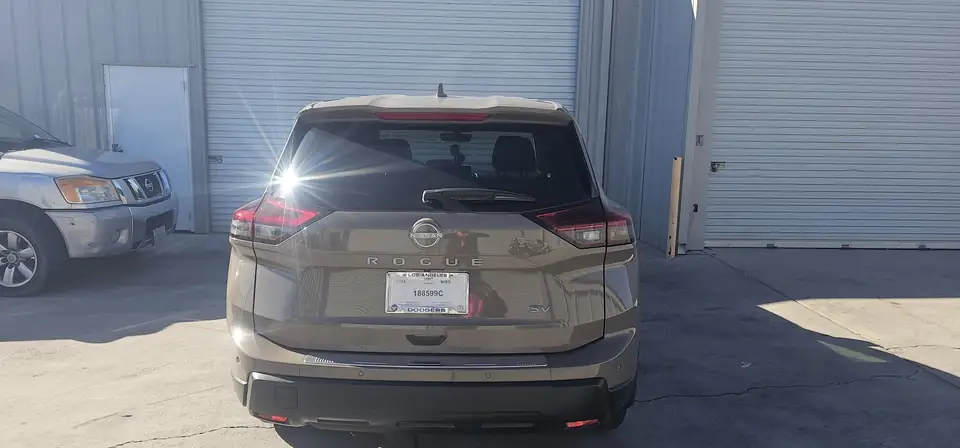 2024 Nissan Rogue window tint: 20% Carbon On Front 2 Windows, 5% Carbon on all Rears, 5% Carbon Visor Strip (view 5)