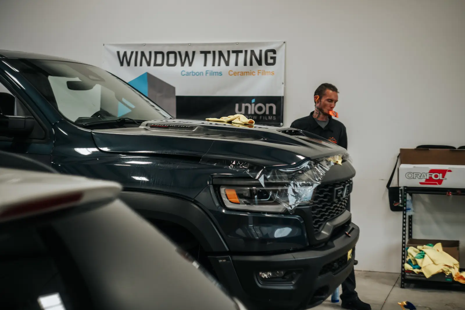 2026 Ram 1500 RHO paint protection film: Stage 2 paint protection film: the front quarter of the hood, the front quarter of both fenders, and the rocker panels front to rear, done at the shop in Prescott Valley (view 3)