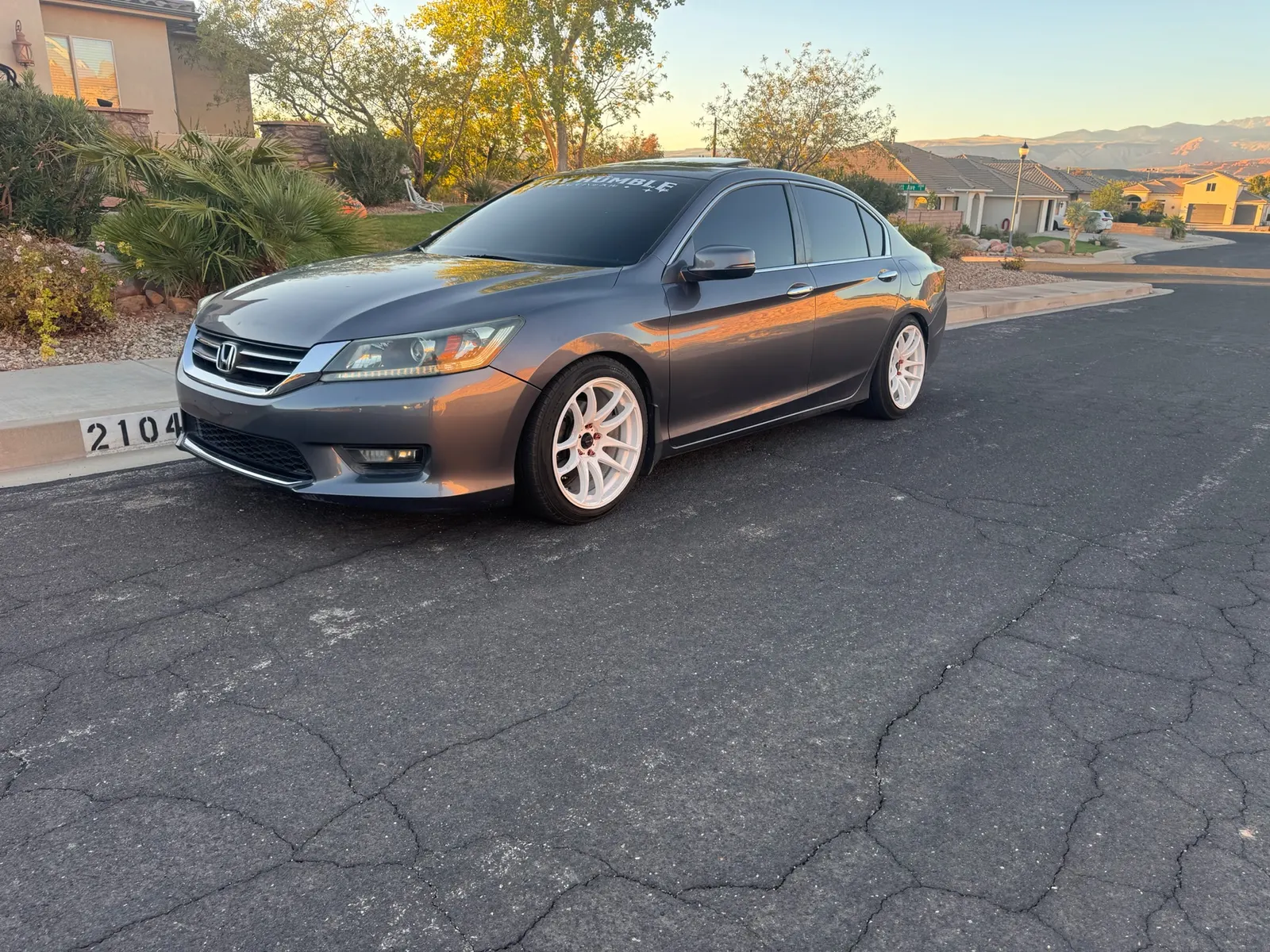 Tinted gray Honda Accord parked on a neighborhood street