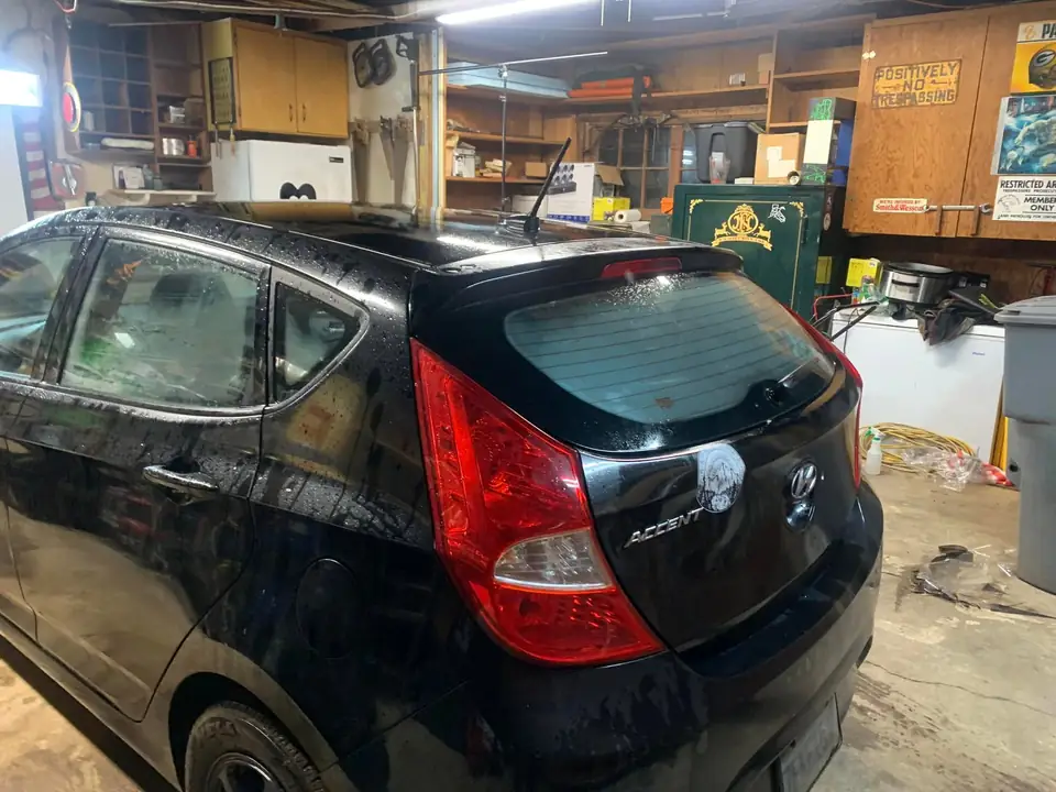 Black hatchback window tint: 5% for rear doors,corner windows and rear hatch, 5% 10inch sun strip (view 3)