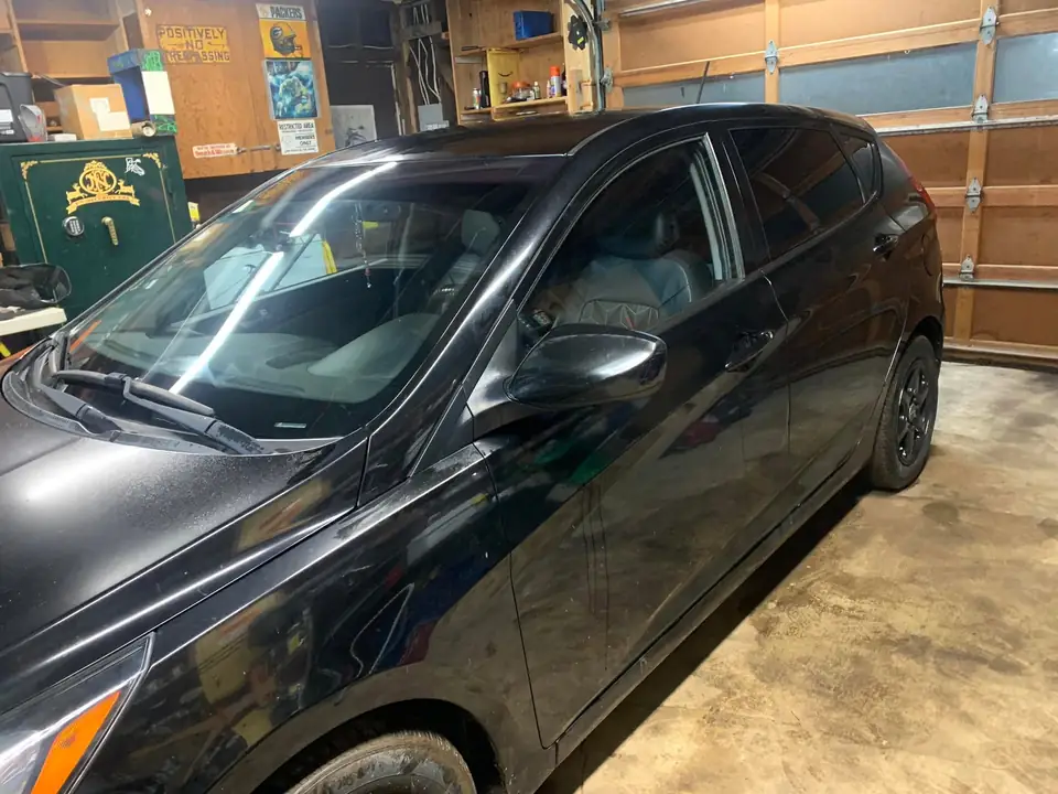 Black hatchback window tint: 5% for rear doors,corner windows and rear hatch, 5% 10inch sun strip (view 4)