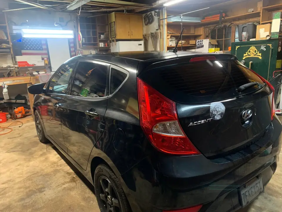 Black hatchback window tint: 5% for rear doors,corner windows and rear hatch, 5% 10inch sun strip (view 6)