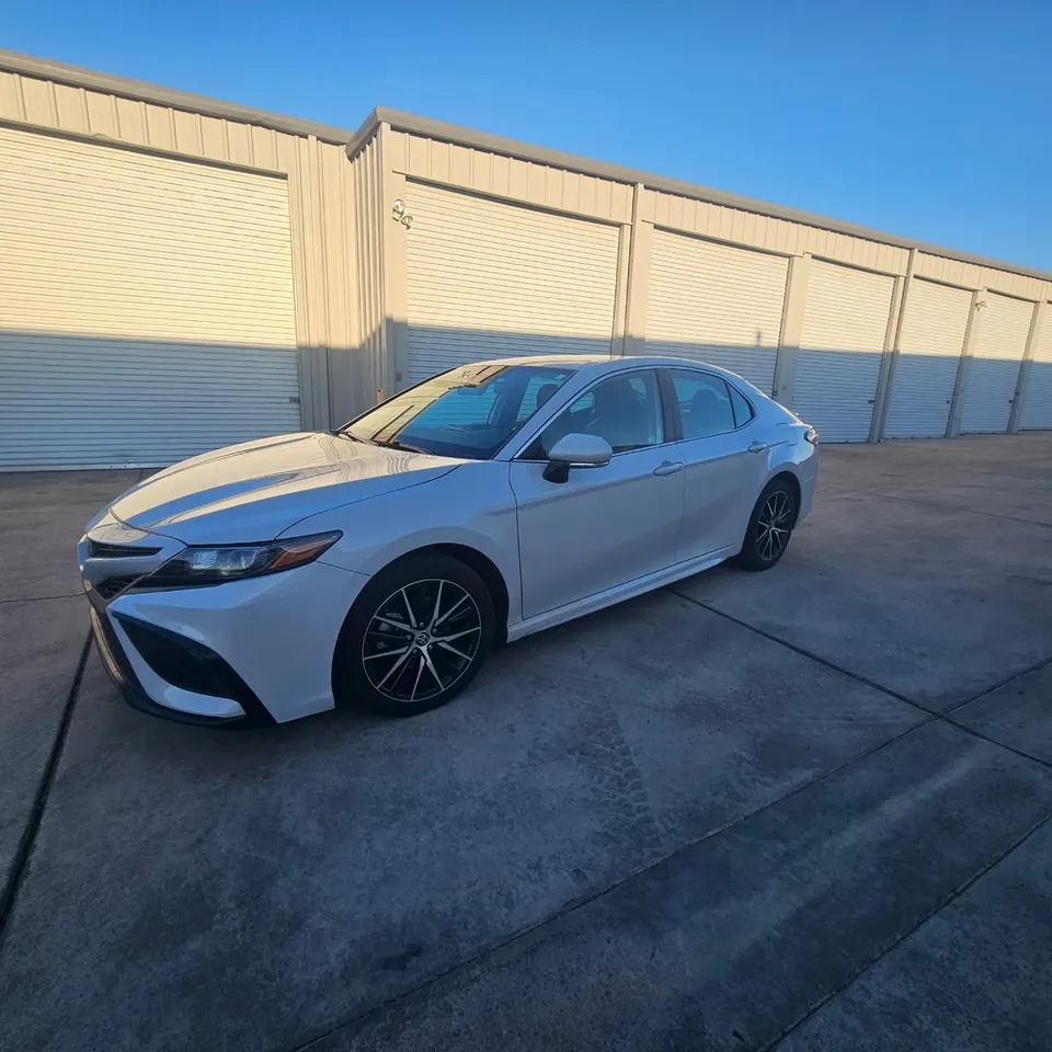 White Toyota Camry with tinted windows