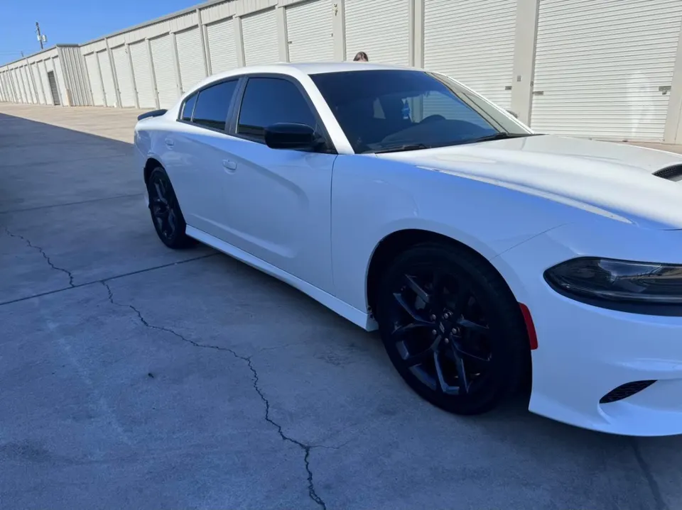 White Dodge Charger with tinted windows