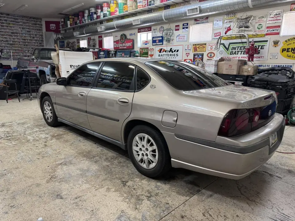 Chevy Impala window tint: 5% all sides and rear and windshield strip (view 2)