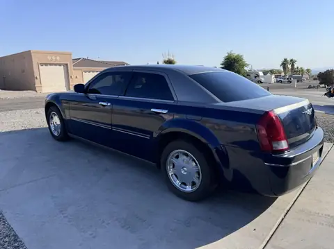 Chrysler 300 window tint: Installed our 15% carbon Ceramic on the doors and rear glass, 3% carbon ceramic sun roof, 5% windshield strip (view 2)