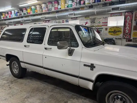 Classic Chevy Suburban window tint: Installed 5% on the two front doors and the rear hatch, Installed 15% on the rear doors and rear cargo windows