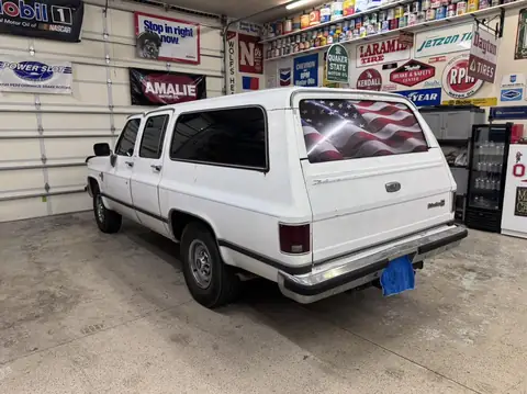 Classic Chevy Suburban window tint: Installed 5% on the two front doors and the rear hatch, Installed 15% on the rear doors and rear cargo windows (view 4)
