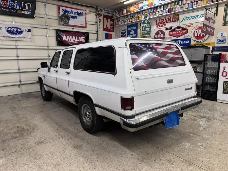 Classic Chevy Suburban window tint: Installed 5% on the two front doors and the rear hatch, Installed 15% on the rear doors and rear cargo windows (view 4)